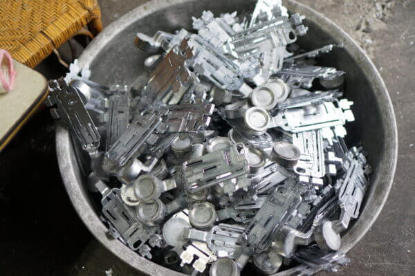 Aluminum parts in bin for Design for Manufacturing
