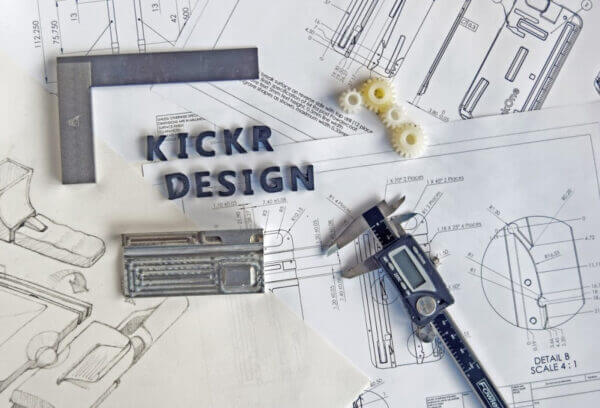 Kickr Design logo over sketch paper