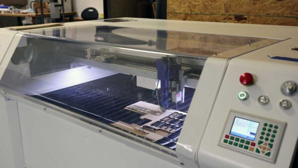 View of laser cutter inside the Kickr Design office